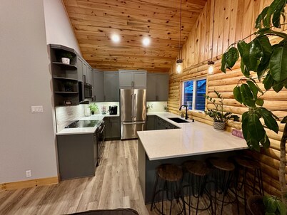 Waterfront Log Home with Beach and Hot Tub. Pet Friendly!