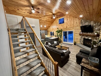 Waterfront Log Home with Beach and Hot Tub. Pet Friendly!