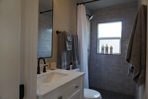Shower, hair dryer, towels, soap