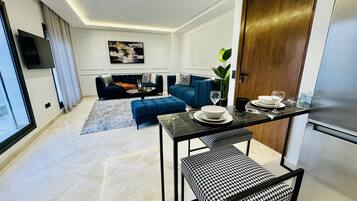 Luxury Apartment, Balcony, Courtyard View | Living area | 55-inch Smart TV with digital channels, Netflix, streaming services