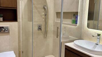 Shower, hair dryer, towels, soap