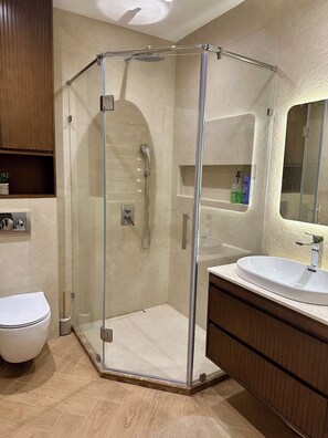 Shower, hair dryer, towels, soap