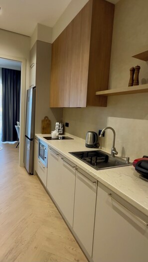 Fridge, microwave, stovetop, coffee/tea maker