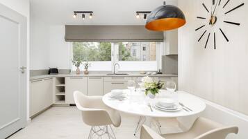 Royal Apartment | Living area | 50-inch Smart TV with cable channels