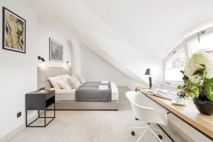 Royal Apartment | Living area | 50-inch Smart TV with cable channels