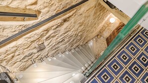 A staircase with a textured wall, a patterned floor, and a light fixture. - Aquipic, 2BR/1BA, 4 people (París)
