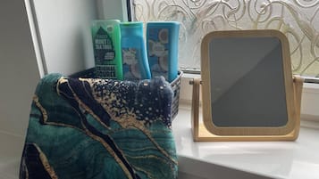 Shower, hair dryer, towels