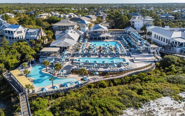 A resort with multiple swimming pools, sun loungers, and a boardwalk. - Single Level WaterColor Home - Steps to Seaside - 3 Bikes (Santa Rosa Beach)