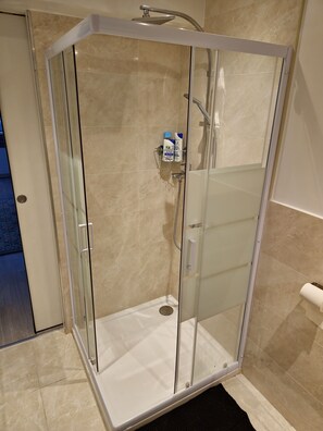 Shower, hair dryer, towels, soap