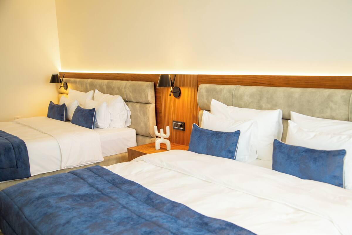Deluxe Quadruple Room | Premium bedding, Select Comfort beds, minibar, in-room safe