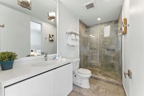 Shower, hair dryer, towels, soap