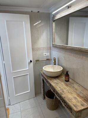 Shower, hair dryer, towels, toilet paper