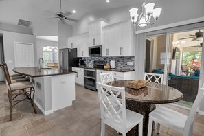 Fridge, microwave, oven, stovetop - 4 BR Solar - Heated Pool & Spacious Living SE Cape (Cape Coral)