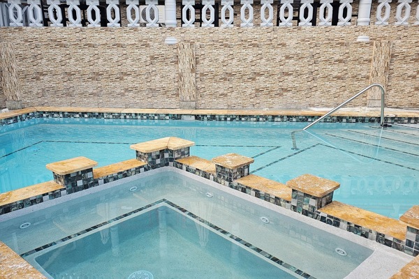 Outdoor pool, open 8:00 AM to 10:00 AM, pool umbrellas