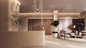 A modern lobby with a curved reception desk, wooden panel walls, and a seating area with sofas and coffee tables. - Limited Edition (Addis Ababa)