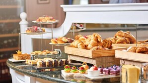 A buffet with various pastries and desserts. - Limited Edition (Addis Ababa)