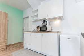 Microwave, stovetop, coffee/tea maker, cookware/dishes/utensils