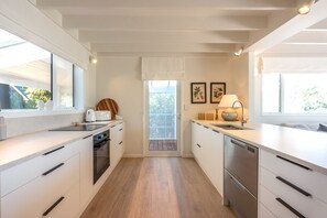 Fridge, microwave, oven, stovetop - Newly renovated waterfront home, with large flat lawn leading to the beach. (Waiheke Island)