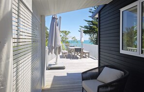 Outdoor dining - Newly renovated waterfront home, with large flat lawn leading to the beach. (Waiheke Island)