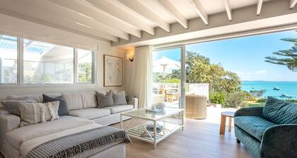 Newly renovated waterfront home, with large flat lawn leading to the beach.