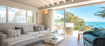 Newly renovated waterfront home, with large flat lawn leading to the beach.