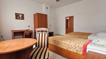 Desk, laptop workspace, bed sheets