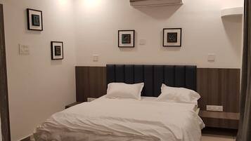 Coffres-forts dans les chambres, fer et planche Ă repasser