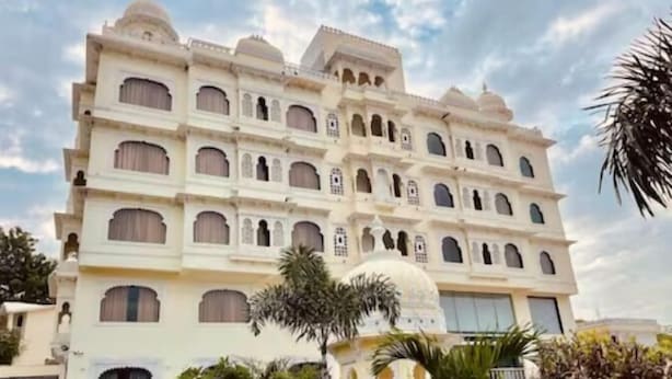 A multi-story building with a traditional architectural style, featuring arched windows and domed structures. - Mewar Palace Resort & Spa (Udaipur)