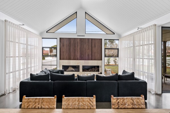 The Loft at Maple Cottages | Living area | 50-inch flat-screen TV with digital channels, fireplace - Maple Suite, Berry - by Linnaeus Collection (Berry)