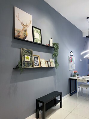 Relax in a serene space with a comfortable bench and ample shelving for personal touches.