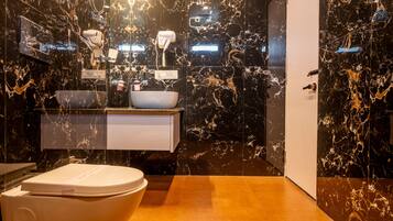 Shower, rainfall showerhead, designer toiletries, hair dryer