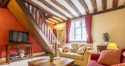 Medieval house with wonky beams and sloping wooden - Duke's Lodge
