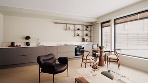 A modern kitchen with a dining area, wooden shelves, and a large window. - A-One Homes Sommerro (Oslo)