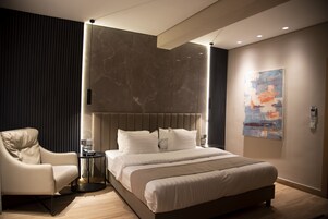 Premium bedding, down comforters, memory foam beds, minibar