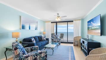 Signature Condo, 3 Bedrooms, Balcony, Beach View | Living room | 65-inch Smart TV with cable channels