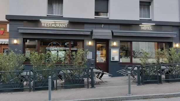 A building with a restaurant and hotel on the ground floor.