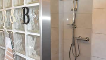 Shower, towels, soap, toilet paper