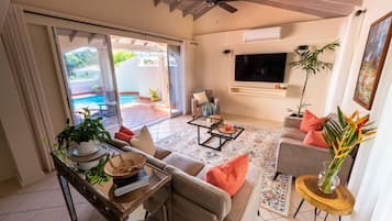 Luxury Villa, Garden View | Living room | Flat-screen TV