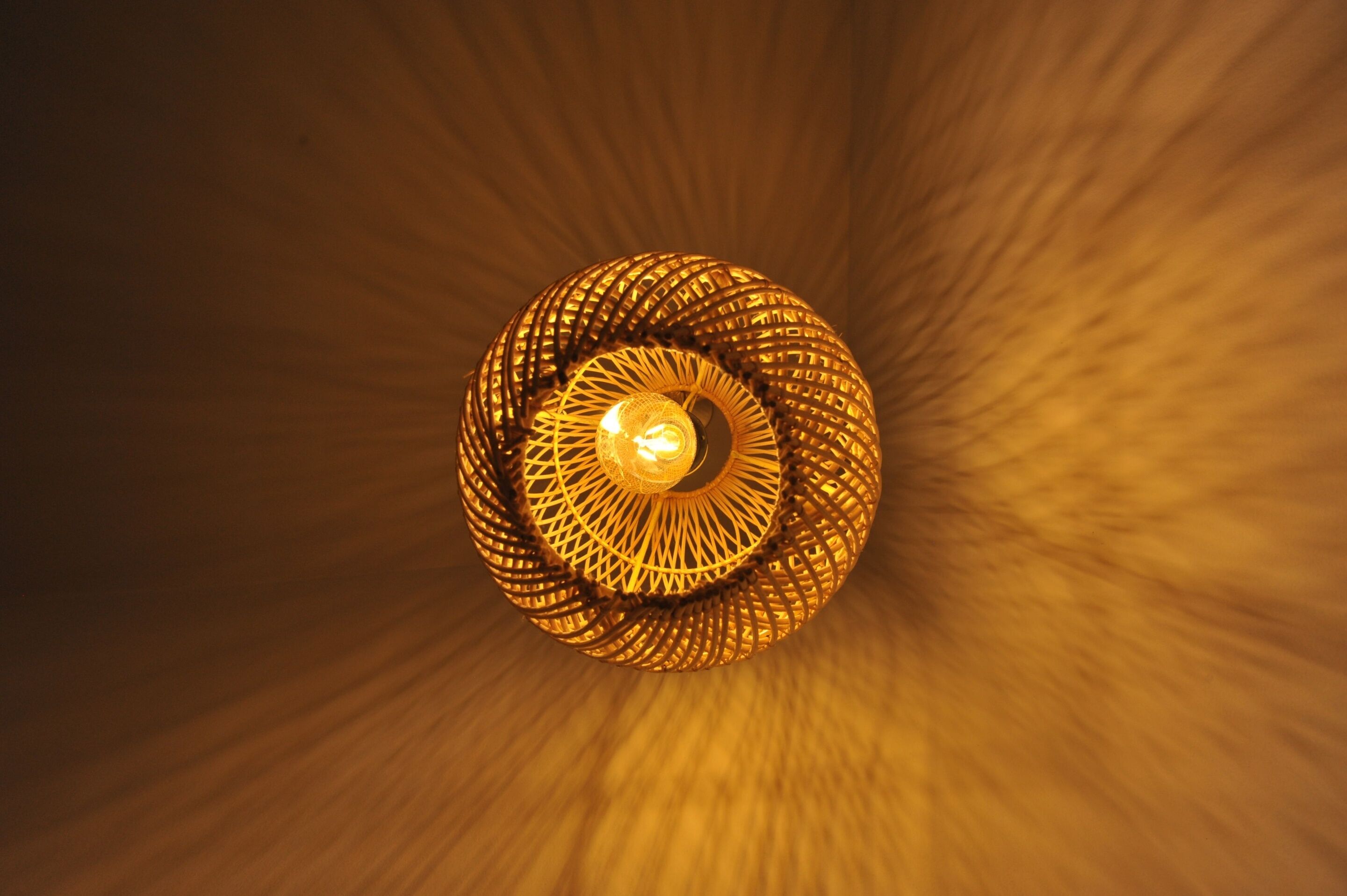 A spiral chandelier with a central light fixture.