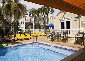 2 outdoor pools, open 8:00 AM to 8:00 PM, pool umbrellas