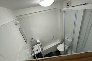 Shower, towels, toilet paper