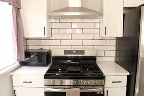 Fridge, microwave, oven, stovetop - Experience convenience and comfort in this cozy fully updated modern home! (Oklahoma City)