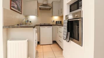 Fridge, electric kettle, toaster, cookware/dishes/utensils