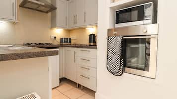 Fridge, electric kettle, toaster, cookware/dishes/utensils