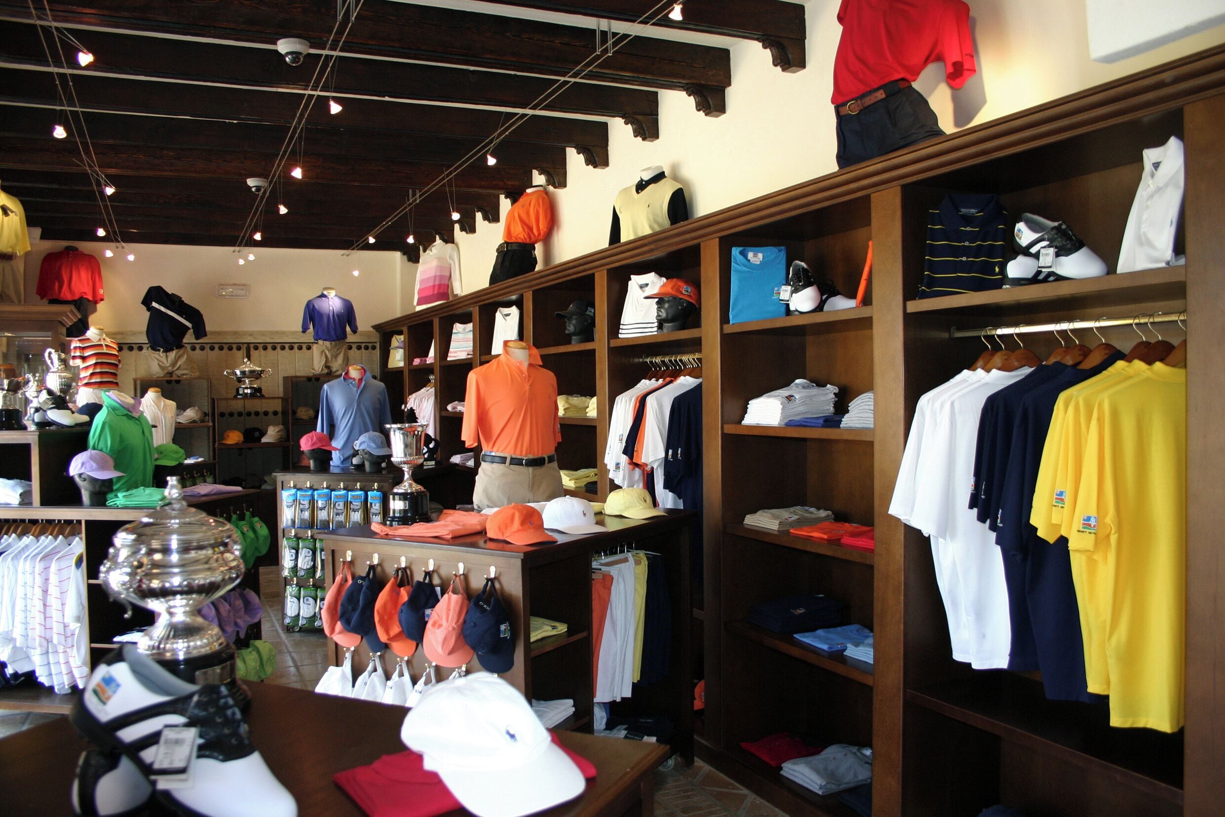 A clothing store with various apparel and accessories on display.