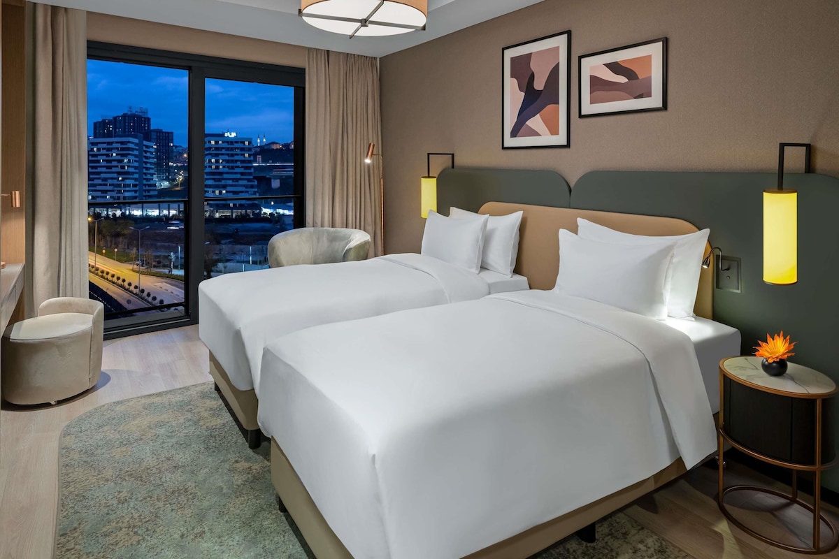 Premium bedding, down duvets, in-room safe, desk