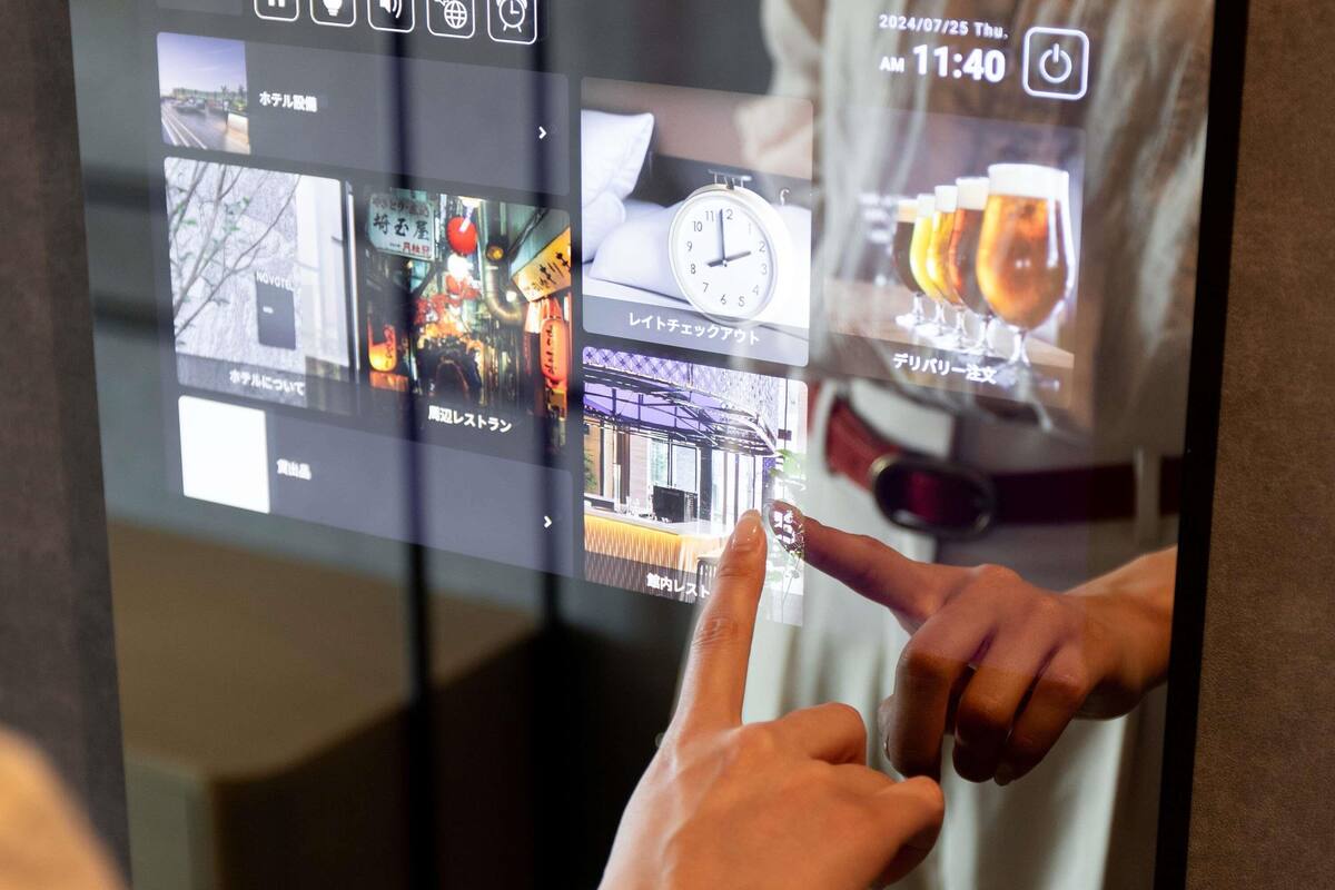 A digital interface with various hotel images, a clock, and a beer glass.
