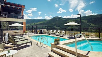 Outdoor pool, open 8:00 AM to 10:00 PM, pool umbrellas, pool loungers