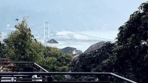 A view from a balcony overlooking a mountainous landscape with a bridge in the distance. - A room facing the holy Ganges (Muni Ki Reti, Rishikesh)