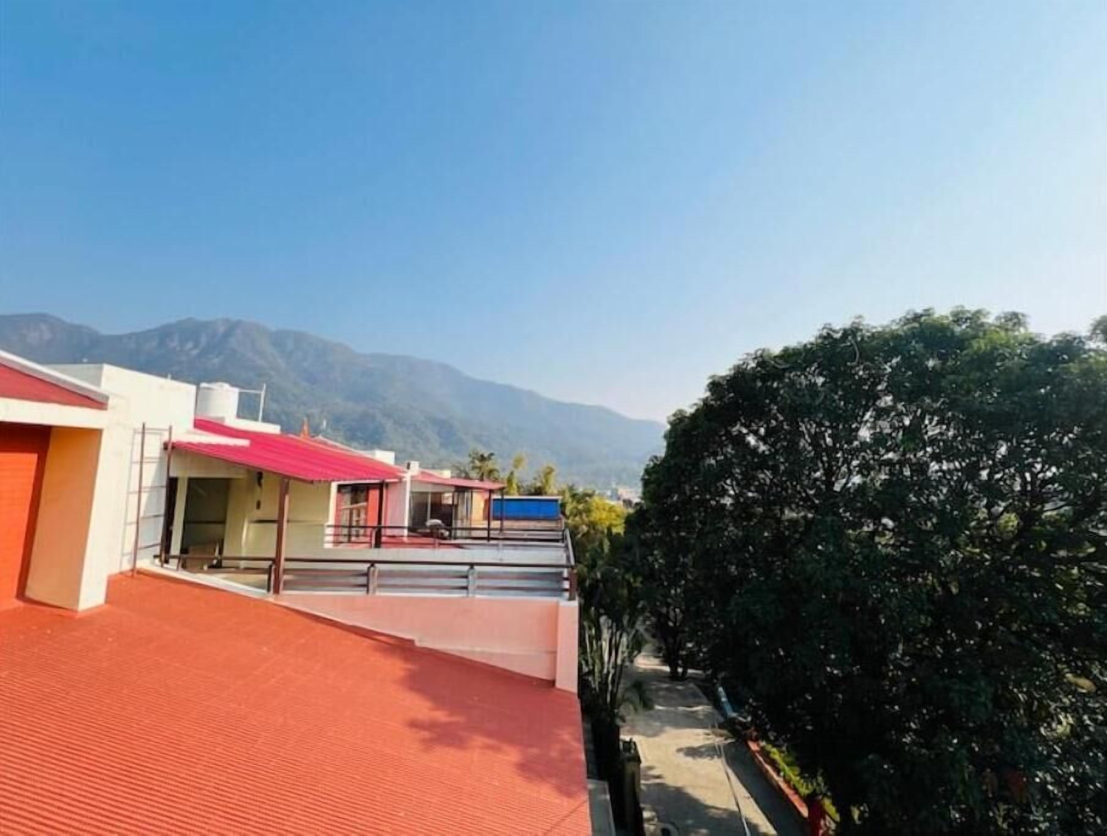 A building with a red roof and a covered walkway.